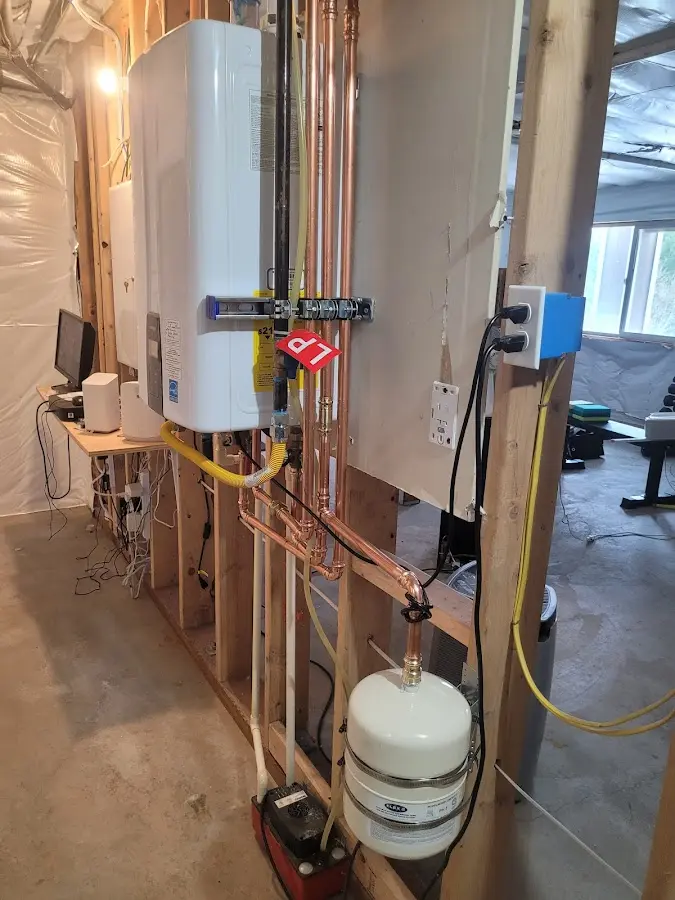 Licensed plumber repairing a kitchen sink in Leitchfield